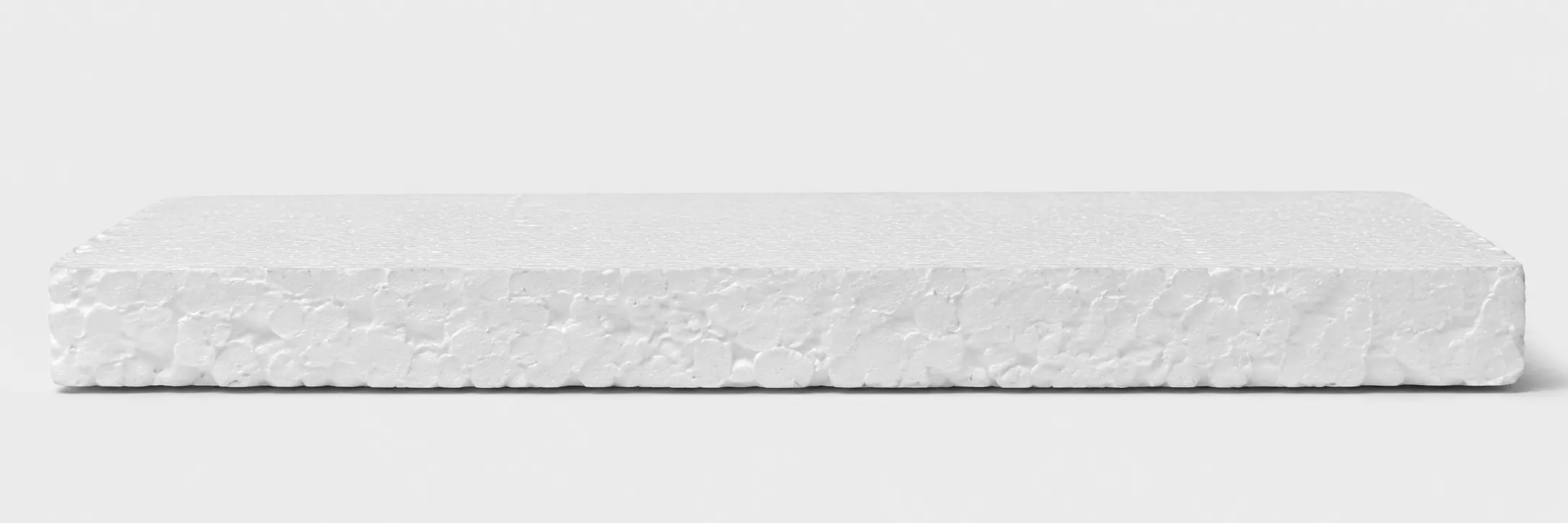Cross-section of a molded EPS part showing white expanded polystyrene beads